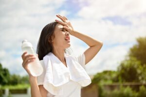 woman sweating on a hot day outside