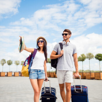 couple with suitcases on vacation